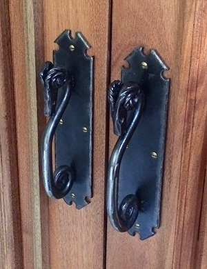 Custom-made ram's head door handles